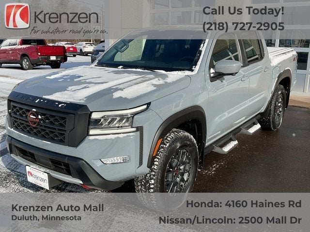 2023 Nissan Frontier PRO-4X in Boulder Gray Pearl — front three-quarter view