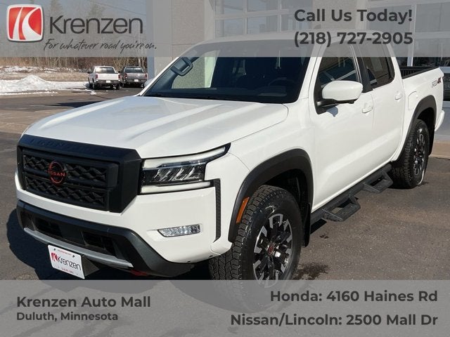 2024 Nissan Frontier PRO-4X in Glacier White — front three-quarter view