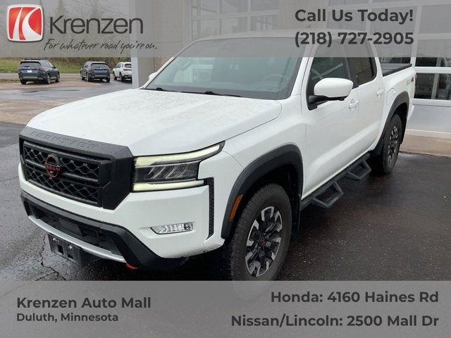 2023 Nissan Frontier PRO-4X in Glacier White — front three-quarter view