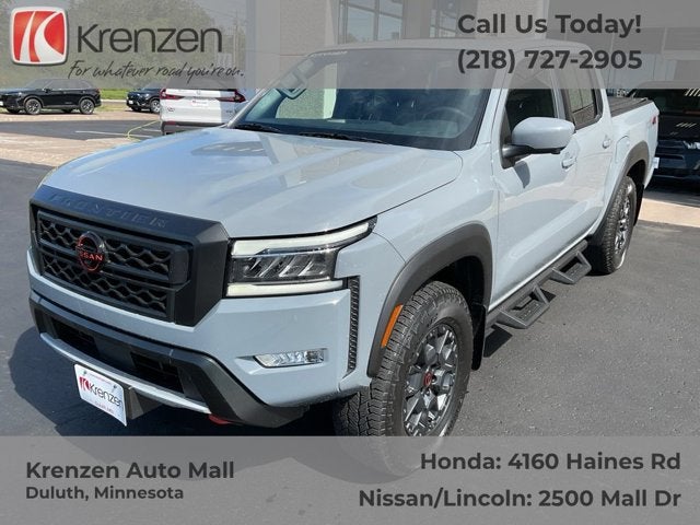 2023 Nissan Frontier PRO-4X in Boulder Gray Pearl — front three-quarter view