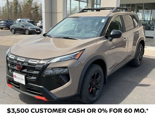 2026 Nissan Rogue Rock Creek in Baja Storm Metallic — front three-quarter view