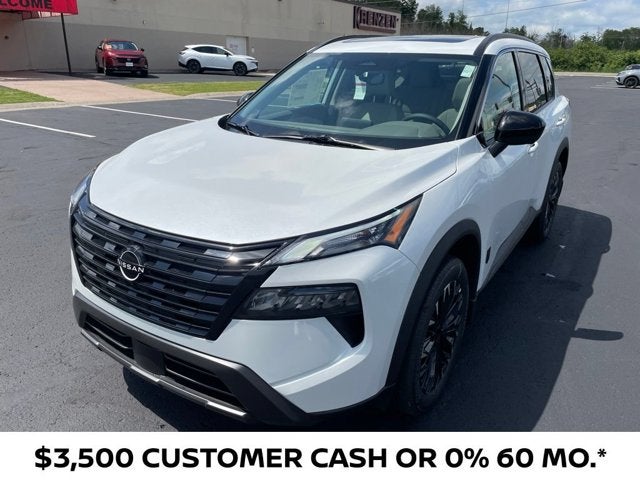 2026 Nissan Rogue Dark Armor in Everest White Pearl Tricoat — front three-quarter view