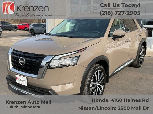 2024 Nissan Pathfinder Platinum in Baja Storm — front three-quarter view