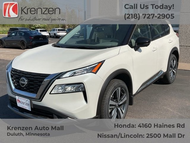 2023 Nissan Rogue SL in Pearl White Tricoat/Super Black — front three-quarter view